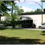a building with cars parked in front of it