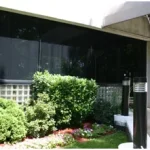 a building with a garden and bushes